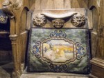 A misericord (sometimes named mercy seat, like the Biblical object) is a small wooden structure formed on the underside of a folding seat in a church which, when the seat is folded up, is intended to act as a shelf to support a person in a partially standing position during long periods of prayer.