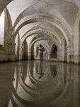 Sound II, statue by Antony Gormley in the flooded crypt