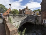 The bridge across the river next to the City Mill