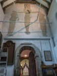 Above the door of the vestry is the 11th century Rood, Carved in stone on what was originally the outer west wall above a Saxon doorway, the Rood was savagely mutilated during the Reformation and Christ's face was gouged out.